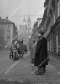 postovni-vuz-tazeny-konem-v-karmelitske-ulici-na-male-strane-v-pozadi-chram-sv-mikulase-1959.jpg