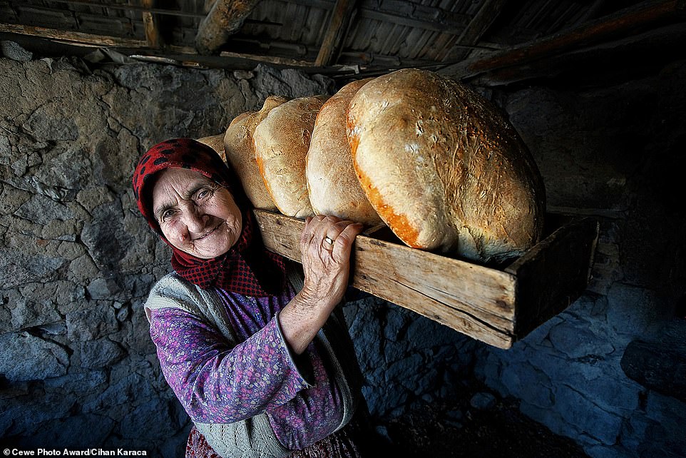 18963638-7507883-food-category-winner-an-elderly-woman-carries-a-basket-of-bread--a-55-1569514368587.jpg