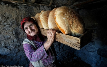 18963638-7507883-food-category-winner-an-elderly-woman-carries-a-basket-of-bread--a-55-1569514368587.jpg