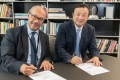 max-berek-innovation-lab--signing-dr-kaufmann-and-ren-zhengfei.jpg